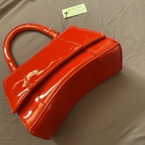 Red handbag with shoulder strap